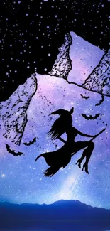 Silhouette of witch flying over starry mountains at night.