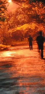 Silhouettes on an orange-lit street at night.