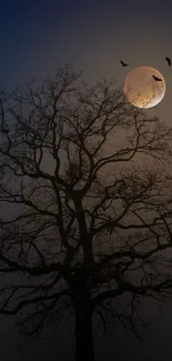 Silhouette of a tree under a full moon with flying birds in a dark sky.