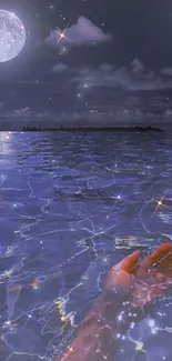 Hand reaching into a moonlit ocean under a starry night sky.