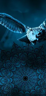 Mystical owl flying over intricate mandala design in blue tones.