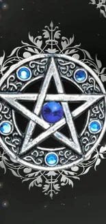 Intricate silver pentagram with blue gems on black background.