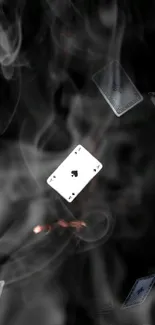 Floating playing cards in smoky design background.