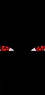 Mystical red eyes staring through black background