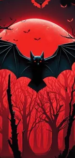 Eerie bat against a red moon in a dark forest wallpaper.