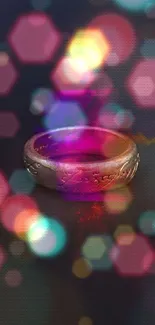 A mystical ring with vibrant neon bokeh lights on a dark background.