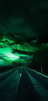 Mysterious road under vibrant green sky in a stunning wallpaper.