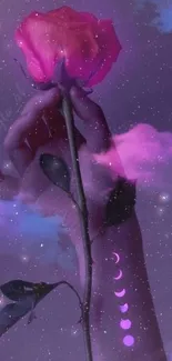 Hand holding a rose in a purple clouded sky with moon phases.