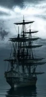 Dark silhouette of a sailing ship under a dramatic night sky.