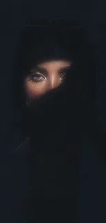 Mysterious shadowed face with piercing eyes, perfect for phone wallpaper.