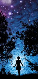 Silhouette in mystical blue and purple night sky with stars.