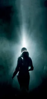 Silhouette of a person in spotlight on a dark, ambient background.