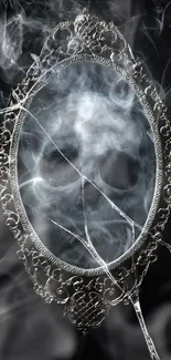 Eerie smoke forming a skull in a gothic mirror against a black background.