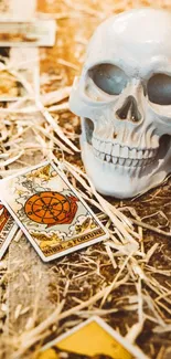 Mystical wallpaper with skull and tarot cards on a straw background.