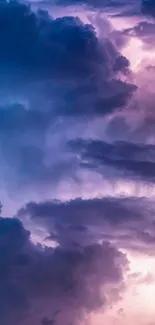 Mystical sky wallpaper with purple and blue clouds.