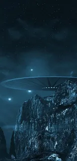 A UFO hovers over rugged mountains under a starry night sky.