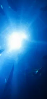 A mystical underwater scene with glowing light rays in the deep blue ocean.