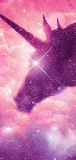 A mystical unicorn silhouette in a vibrant pink galaxy sky with sparkling stars.