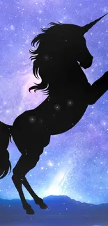 Silhouette of a unicorn against a starry purple galaxy background.