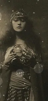 A vintage fortune teller holds a crystal ball in a sepia-toned mobile wallpaper.