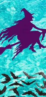 Purple witch silhouette with bats on aqua background.