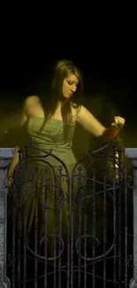 Mystical woman behind wrought iron gate in dark ambiance wallpaper.