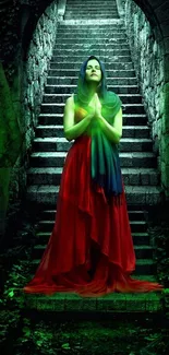 Woman in red dress on stone steps with green mystical glow.