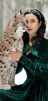 Woman in green velvet dress with lynx in snowy forest.