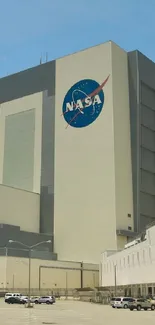 NASA building against a blue sky with a prominent logo and architectural lines.