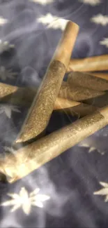 Close-up of brown hand-rolled cigarettes on a fabric with star patterns.