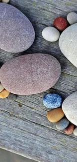 Pebbles arranged on a wooden surface.