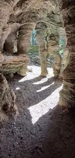 Rustic cave with natural rock formations and sunlight casting shadows.