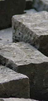 Close-up of natural gray stone texture for mobile wallpaper.