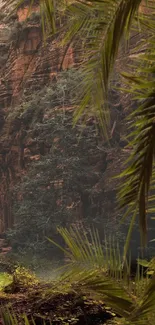 Scenic canyon with lush greenery and palm fronds, creating a serene backdrop.