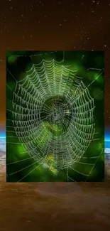 Spider web with Earth backdrop mobile wallpaper.