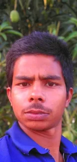 Portrait with green mango tree background, vibrant and natural look.