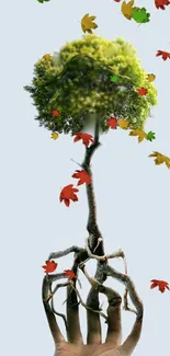 Hand with tree and colorful falling leaves on a light blue background.