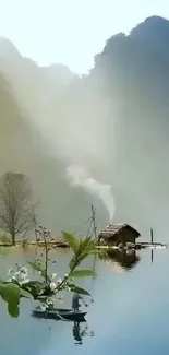 Nature wallpaper with a hut, lake, and misty mountains.