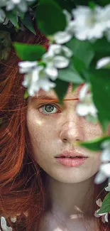 Portrait amidst lush foliage and white flowers, exuding serenity.