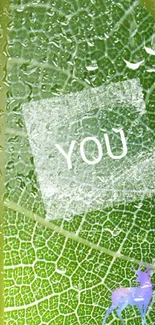 Green leaf texture wallpaper with 'YOU' text and small deer silhouette.