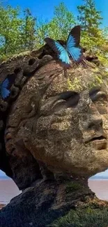 Stone head with trees and butterflies on a sunny landscape.