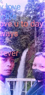 Couple posing with waterfall and love message in nature background.