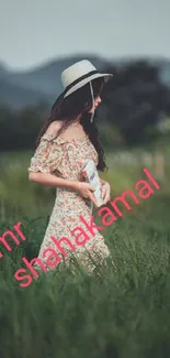 Woman in a floral dress walking through green fields.