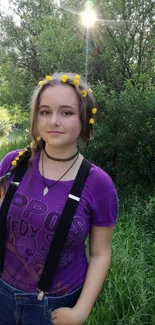 Young girl in nature, purple shirt, flower crown, sunlight on forest path.