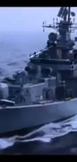 Navy battleship cutting through ocean waters with intense focus and power.