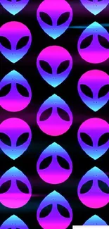 Neon pink and blue alien head pattern on black background wallpaper.