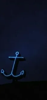 Neon anchor glowing on dark blue background wallpaper.