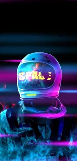 Neon astronaut with glowing helmet design in vibrant space-themed wallpaper.