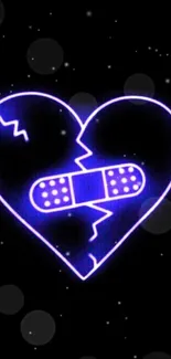 Neon broken heart with bandage on dark background.