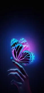 Neon butterfly resting on fingertips with a vibrant glowing effect on a dark background.